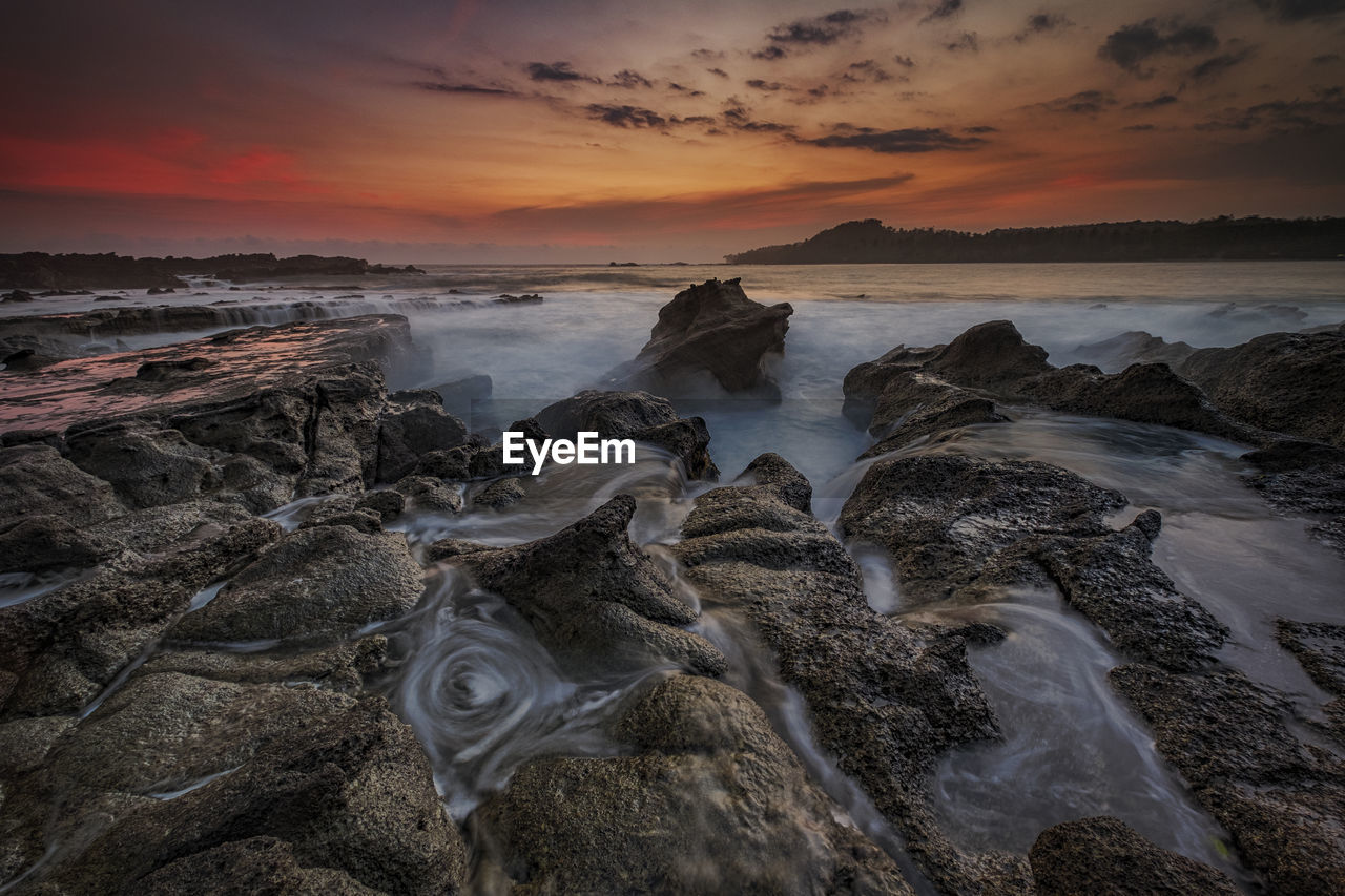 Scenic view of sea against sky during sunset