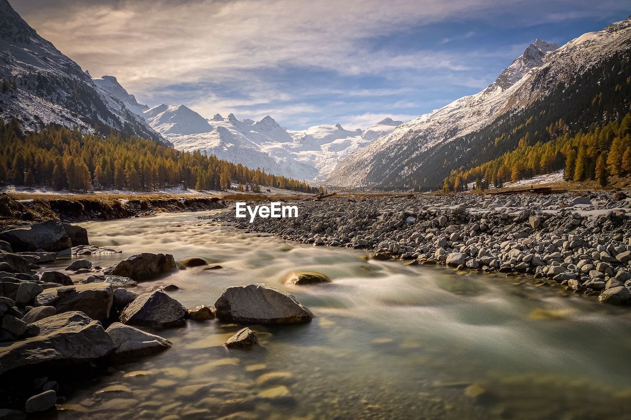 SCENIC VIEW OF SNOWCAPPED MOUNTAINS AGAINST SKY DURING WINTER