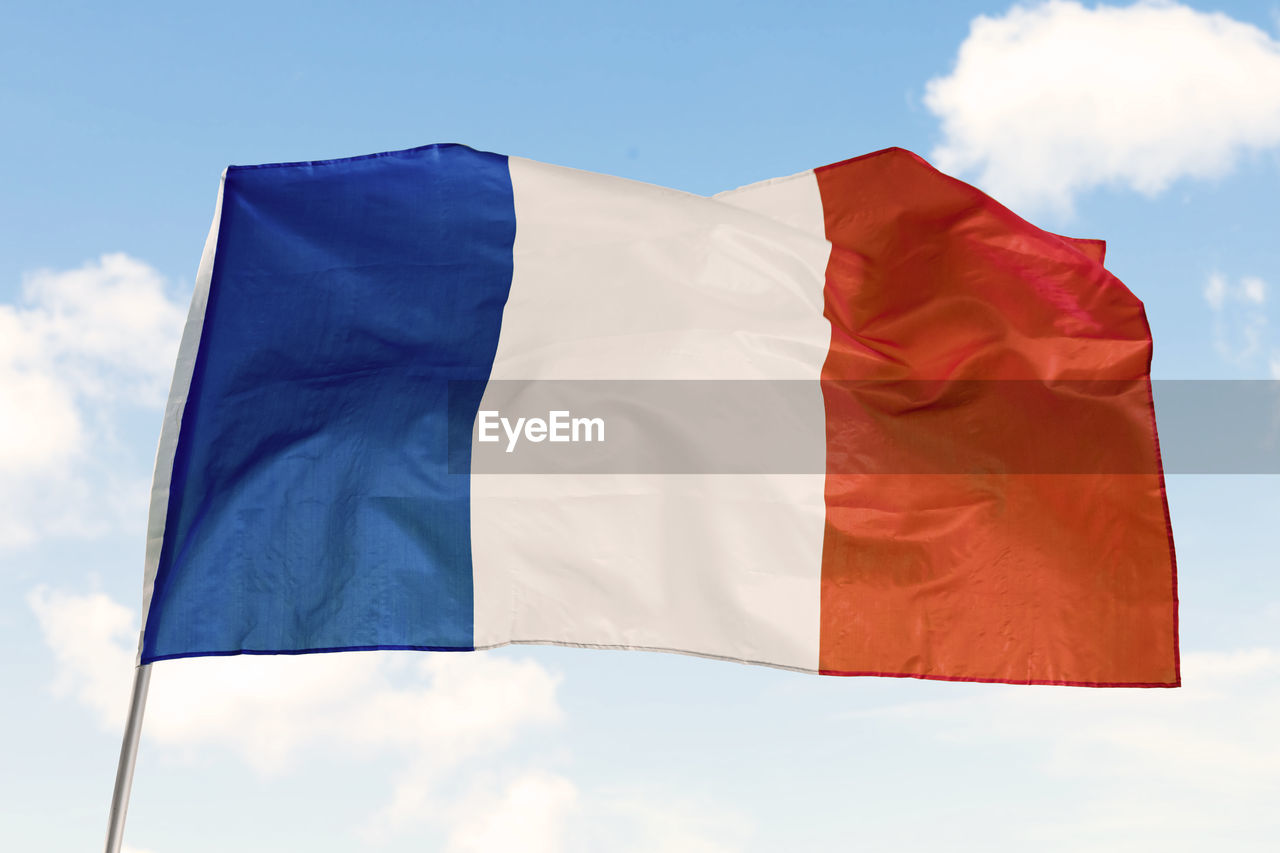 LOW ANGLE VIEW OF FLAGS FLAG AGAINST SKY