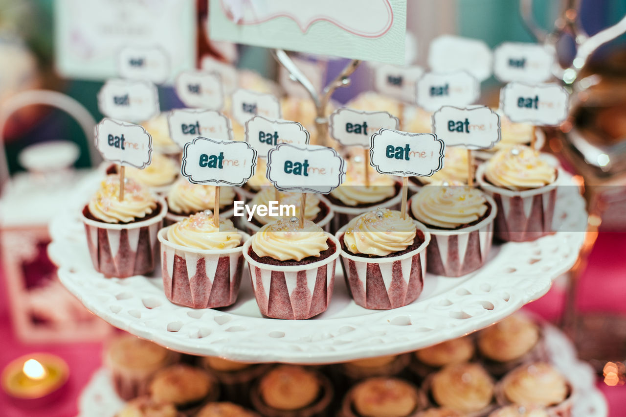 Eat me text on cupcakes