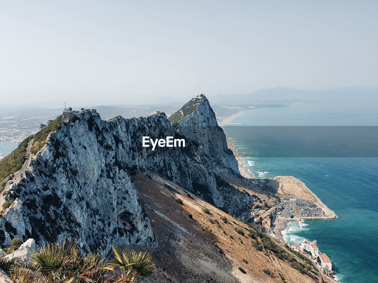 Panoramic view of sea and mountains against sky