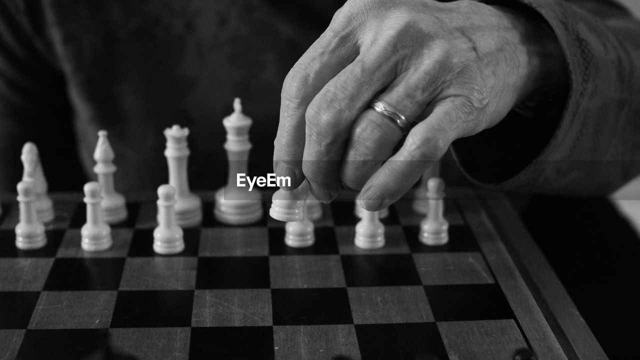 Woman playing on chess board