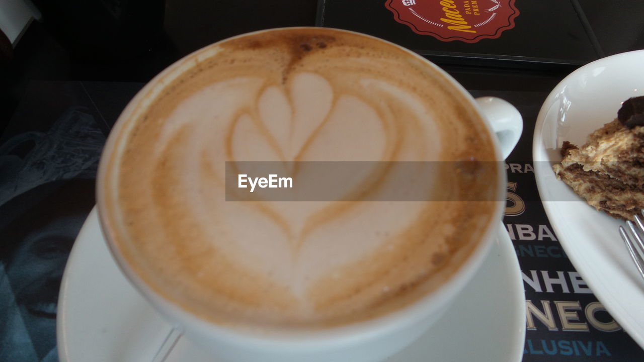 CLOSE-UP OF COFFEE CUP ON TABLE