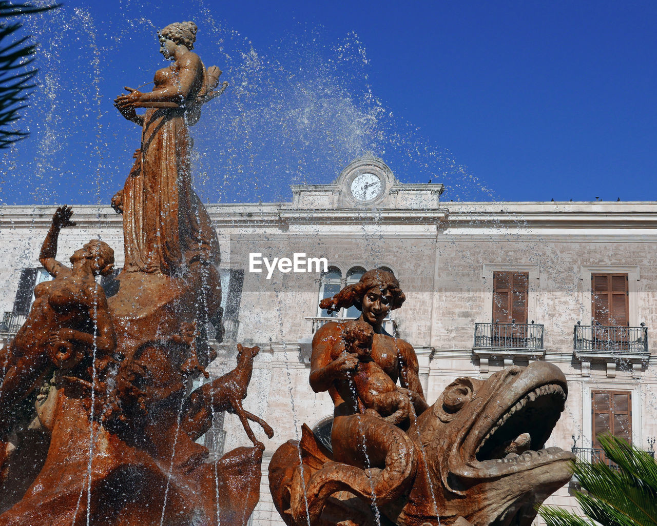 View of a beautiful gushing fountain in ortigia, sicily