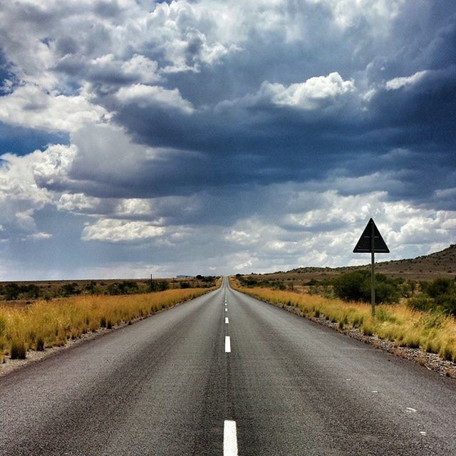 EMPTY ROAD PASSING THROUGH LANDSCAPE