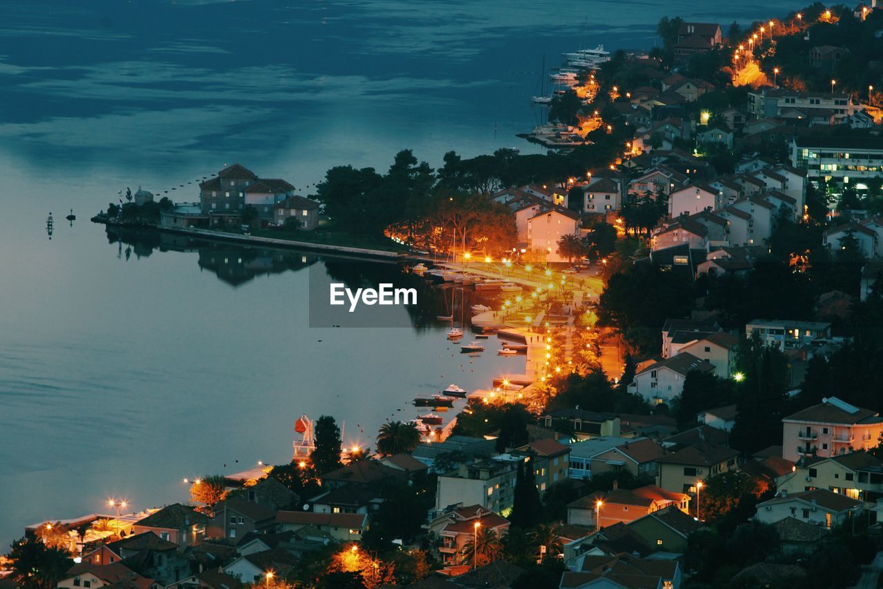 High angle view of illuminated city by kotor bay