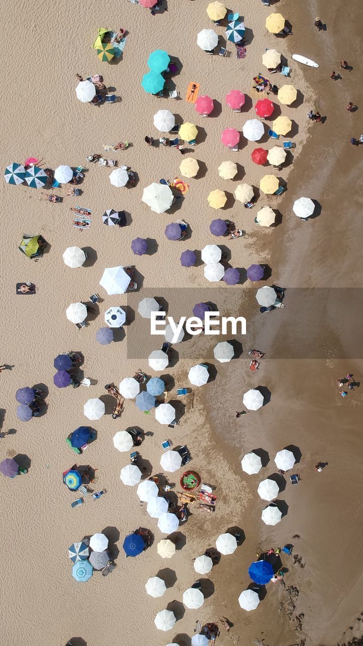 HIGH ANGLE VIEW OF WATER ON BEACH