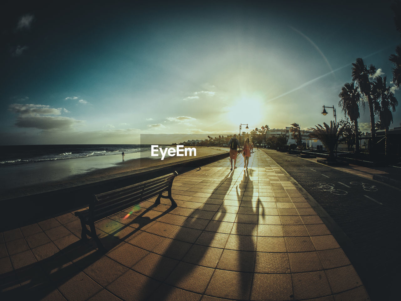 Scenic view of beach footpath during sunset