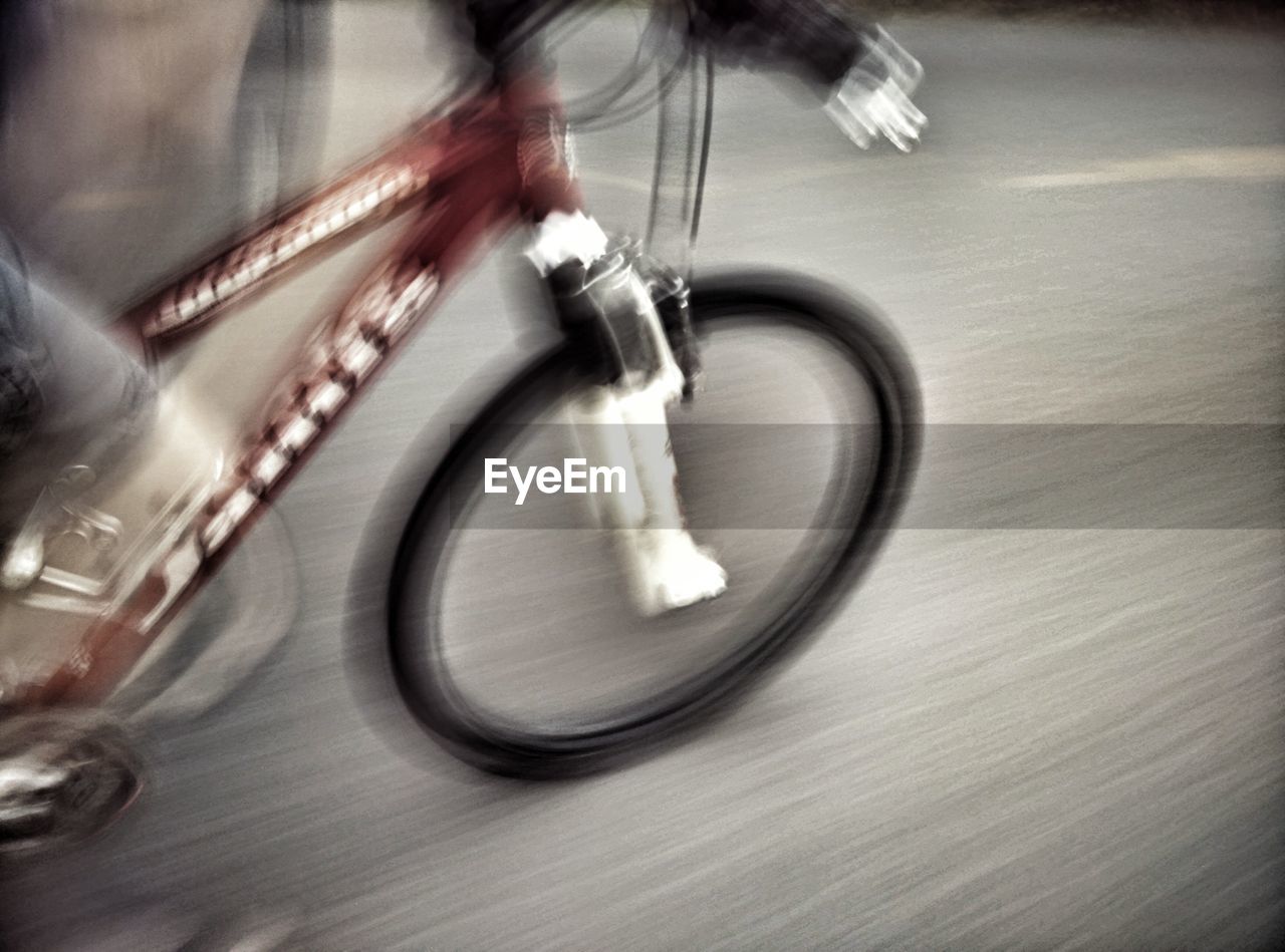 High angle view of person riding bicycle on street