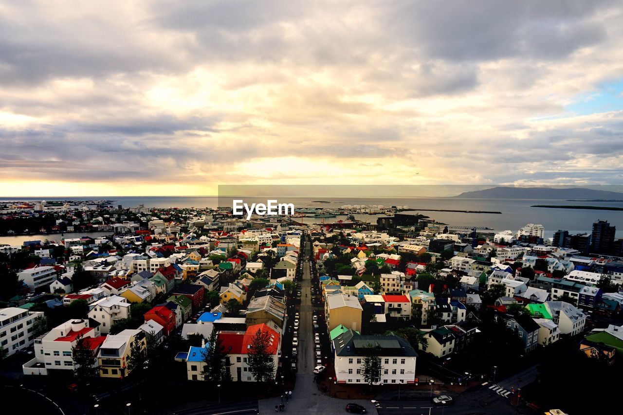 Aerial view of cityscape against sky during sunset