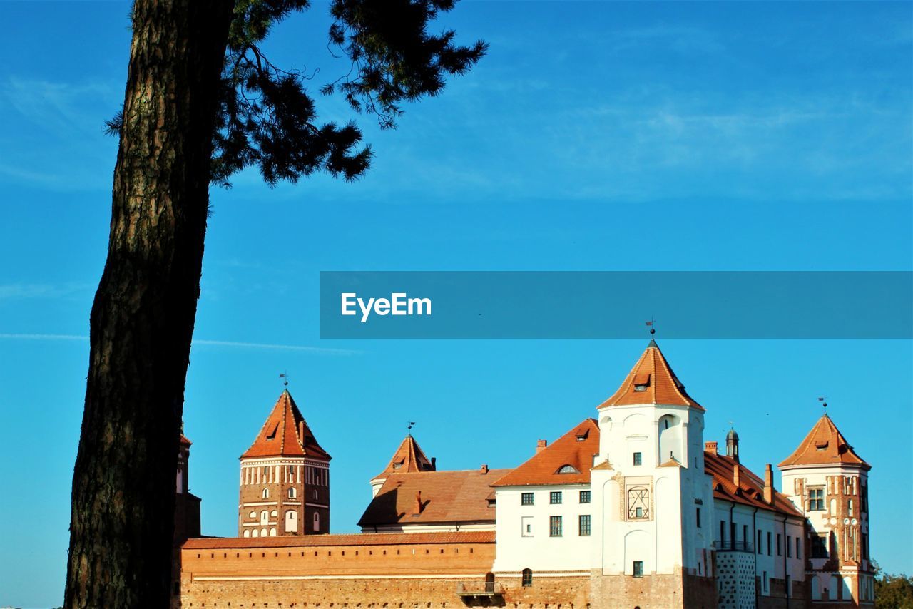 View of buildings against blue sky