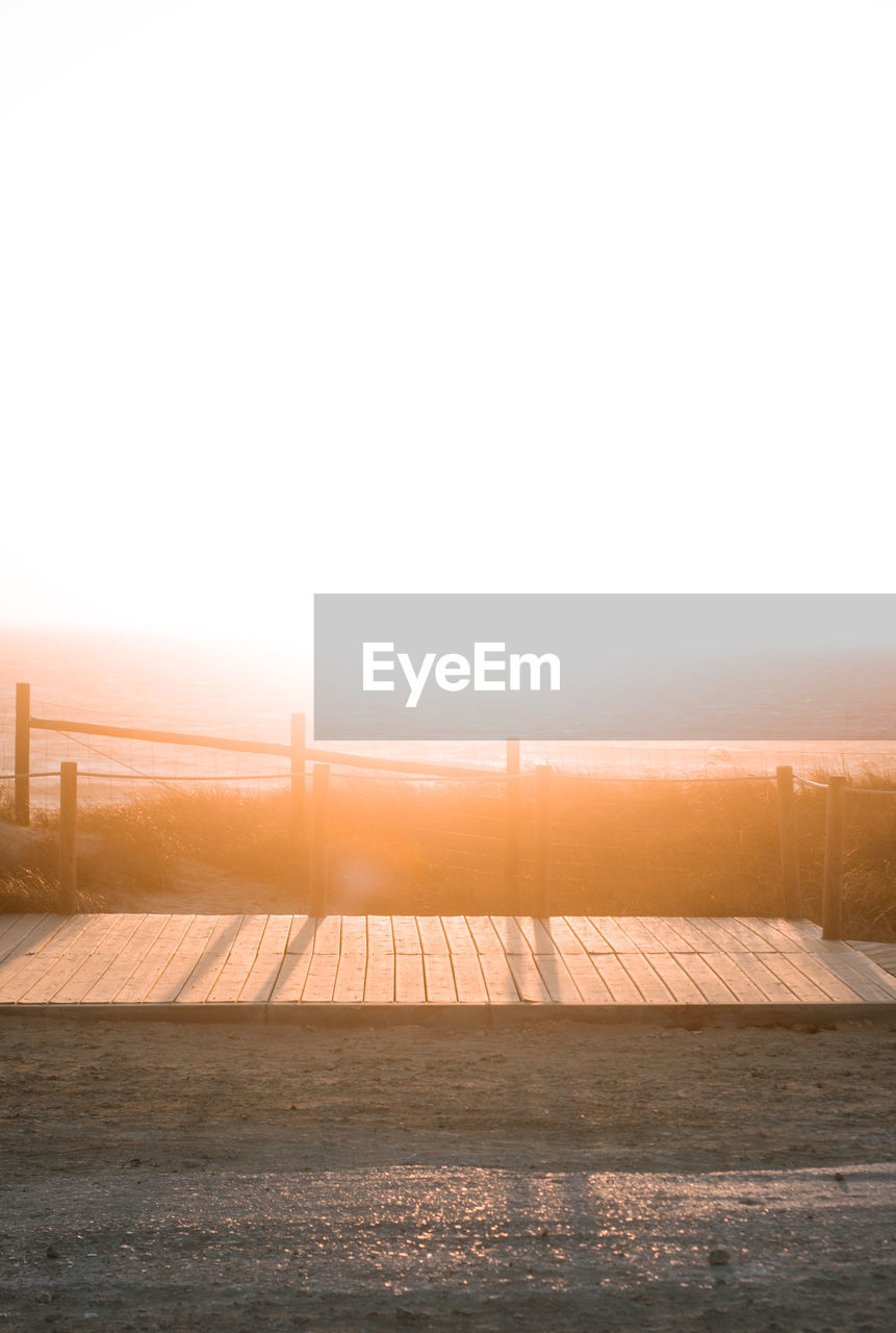 Scenic view of sea against clear sky during sunset