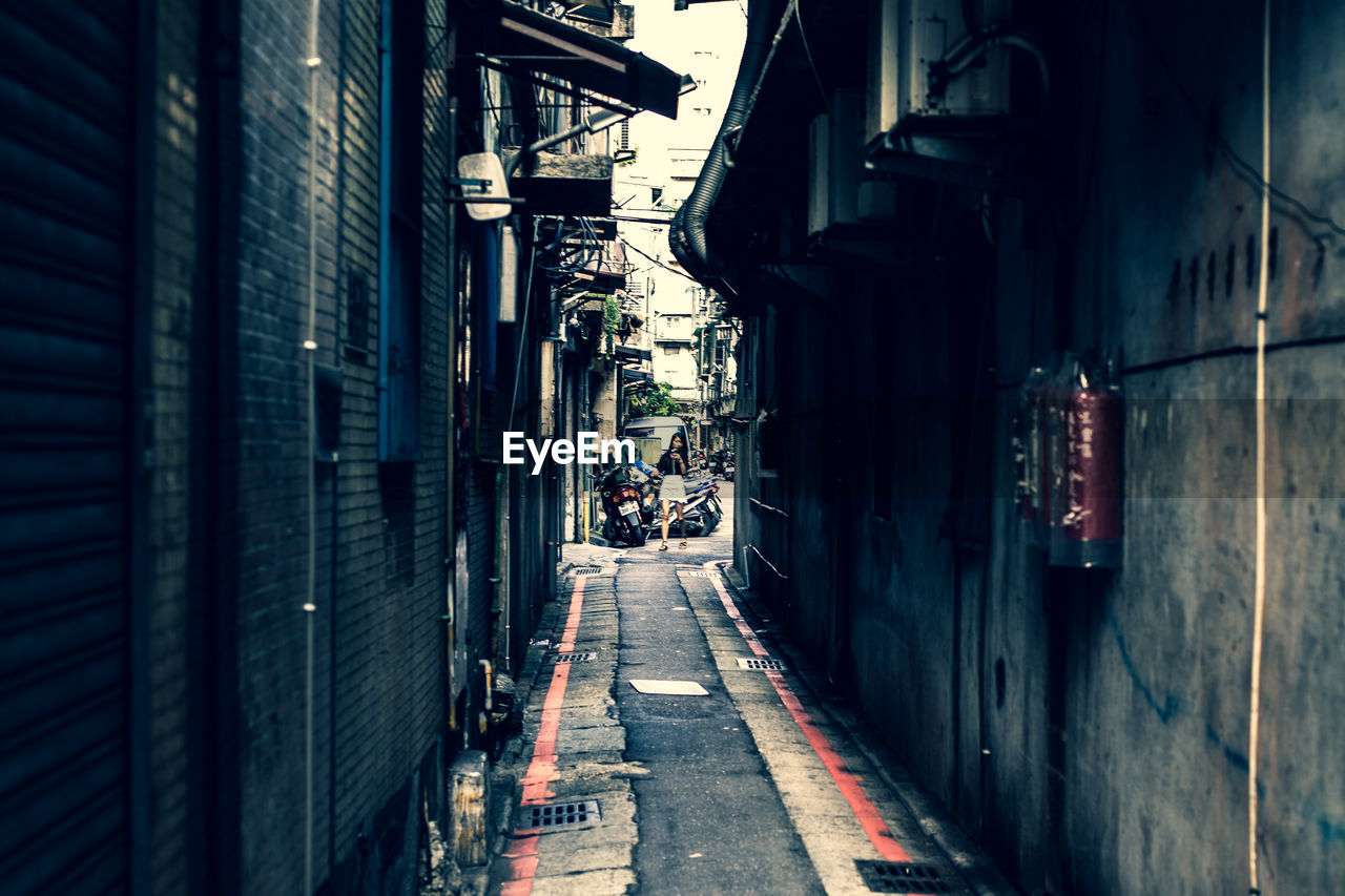 NARROW STREET AMIDST BUILDINGS