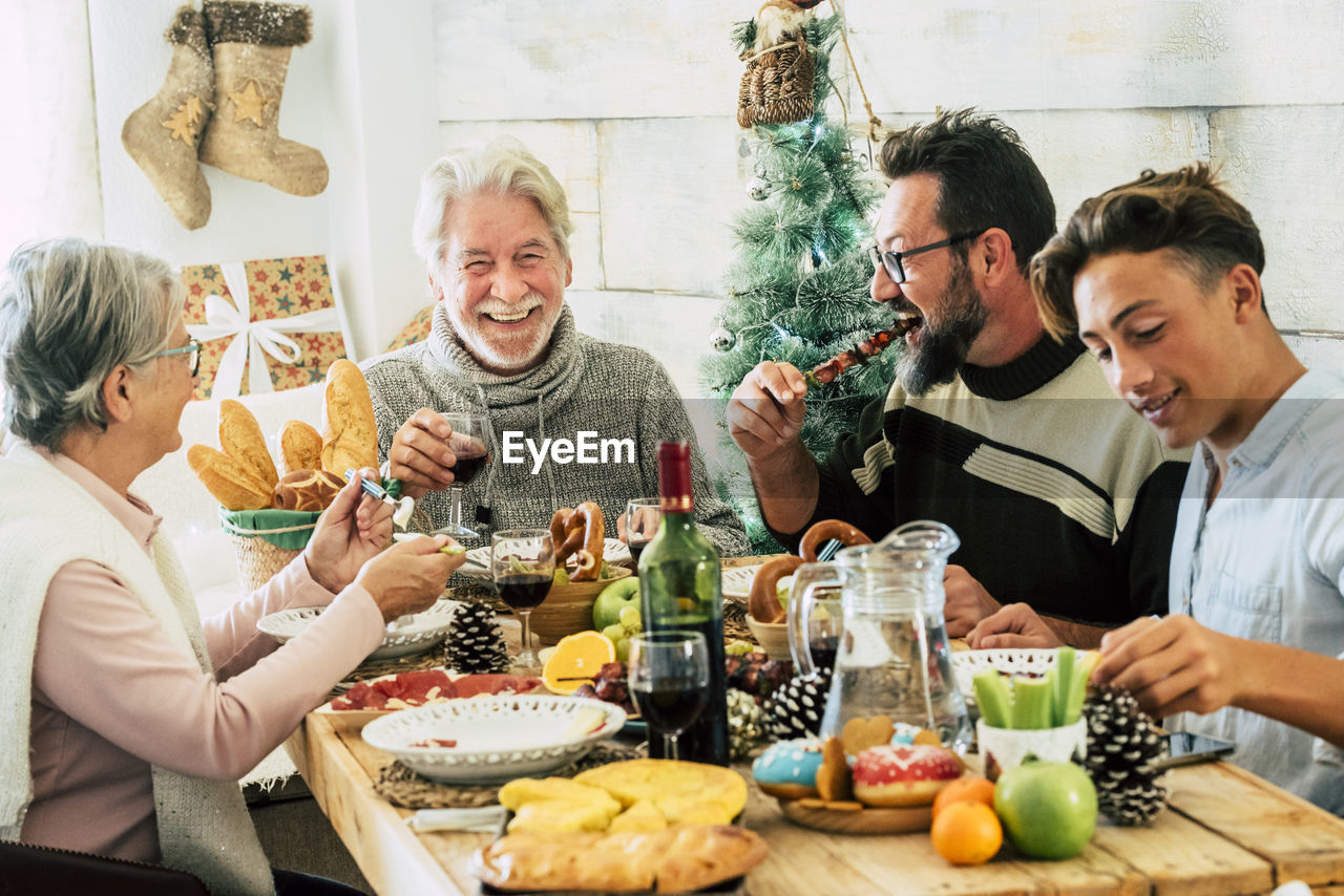 Group of people sitting on table