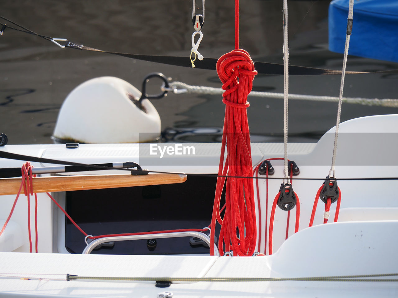 Close-up of ropes in boat moored in lake