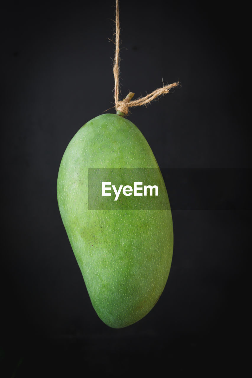 Close-up of apple against black background