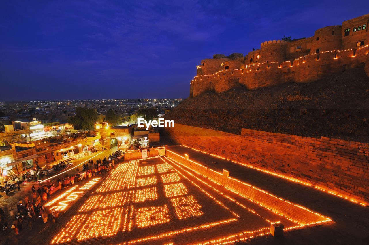 HIGH ANGLE VIEW OF ILLUMINATED CITY