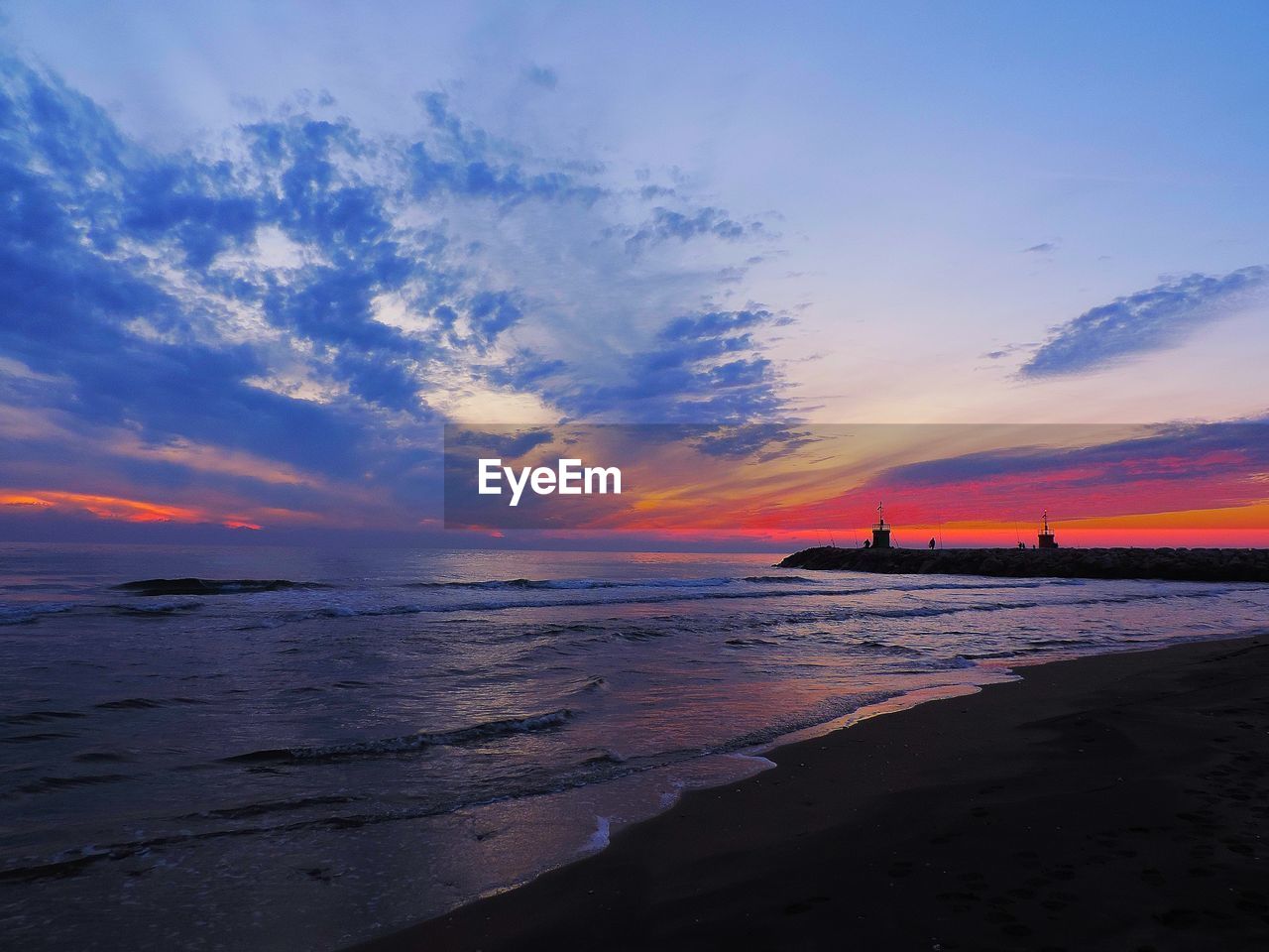 Scenic view of sea against sky during sunset