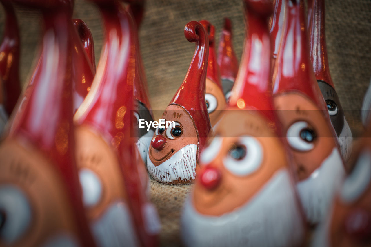 CLOSE-UP VIEW OF FIGURINE ON SHELF