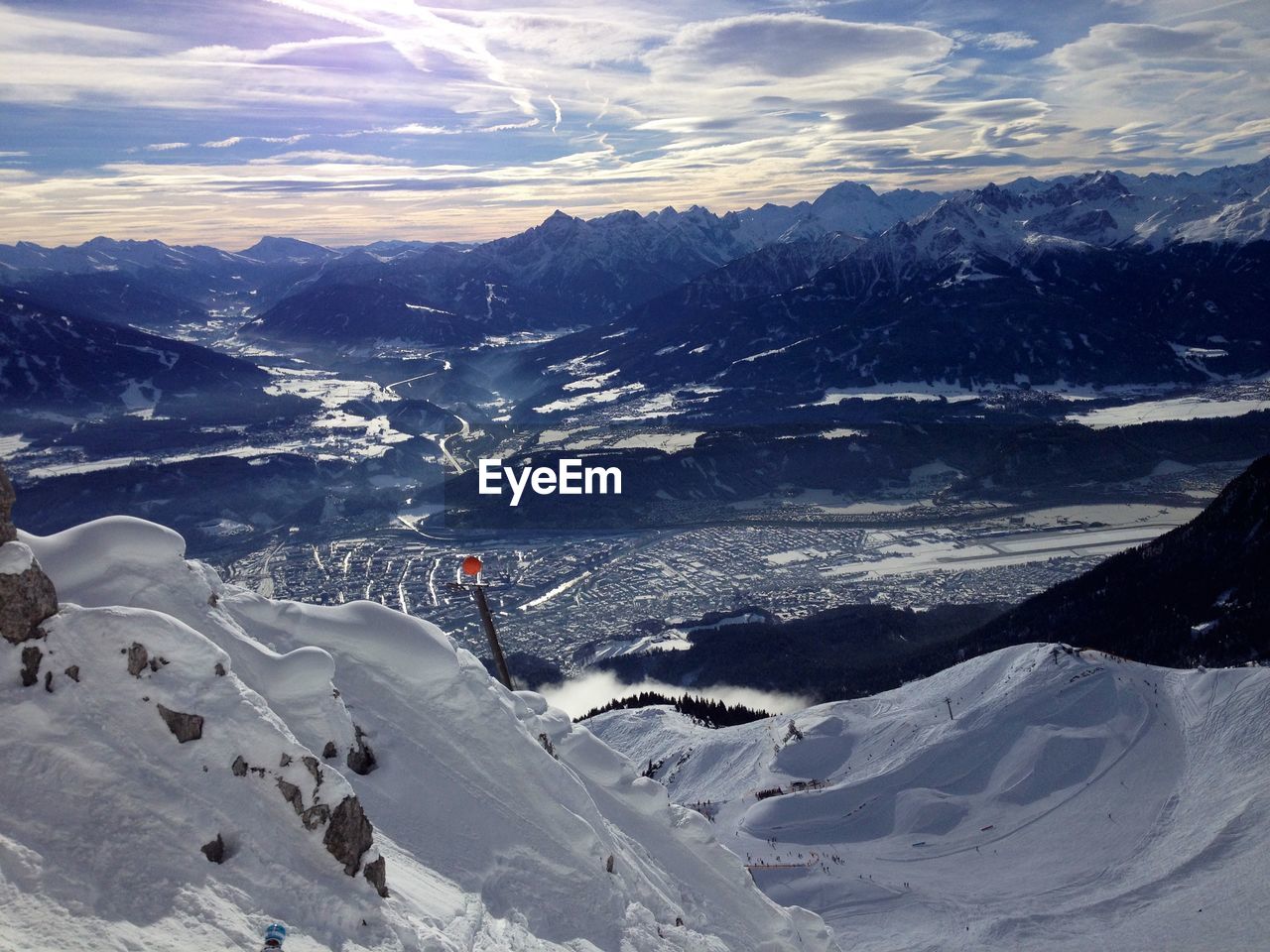 AERIAL VIEW OF SNOW COVERED MOUNTAIN