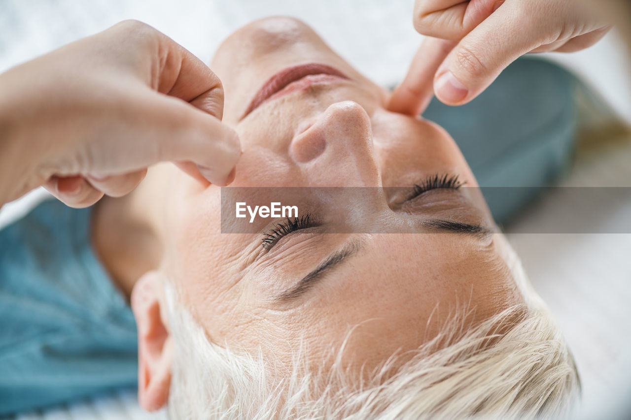 Close-up of woman getting massage at spa