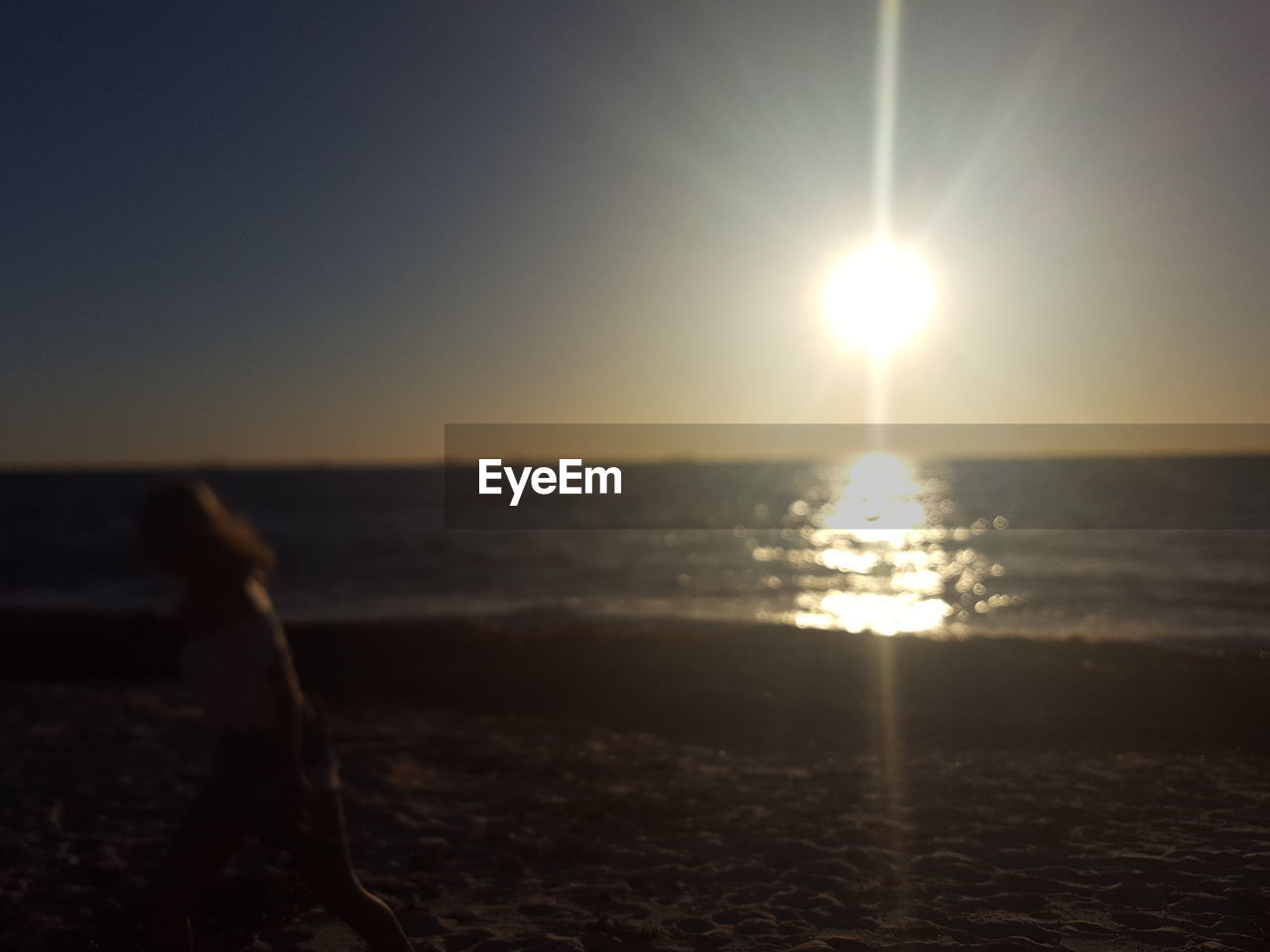 SCENIC VIEW OF BEACH AGAINST SKY DURING SUNSET