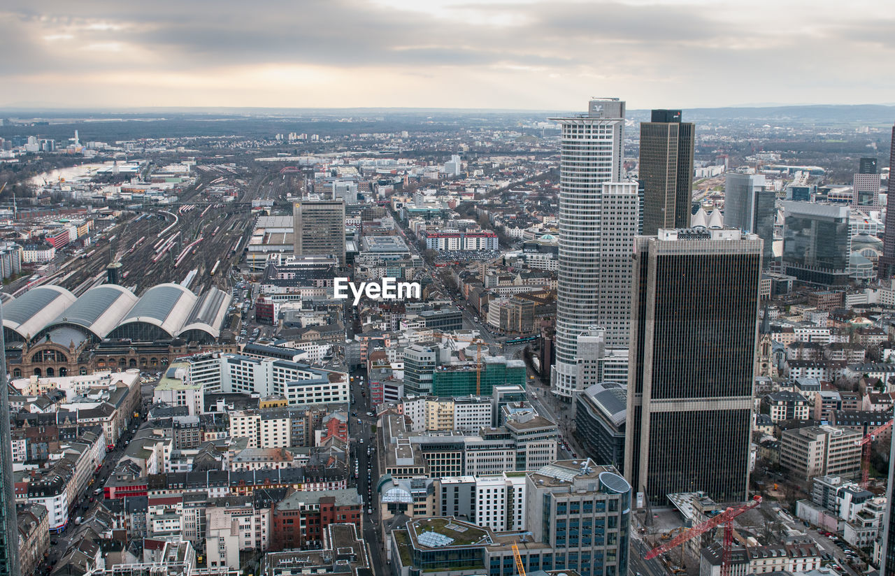 High angle view of modern buildings in city against sky