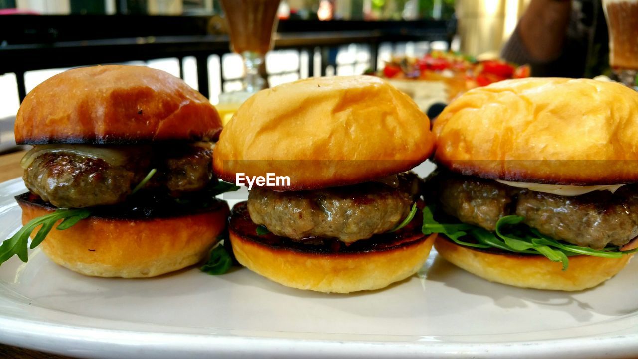 Close-up of hamburgers served on table