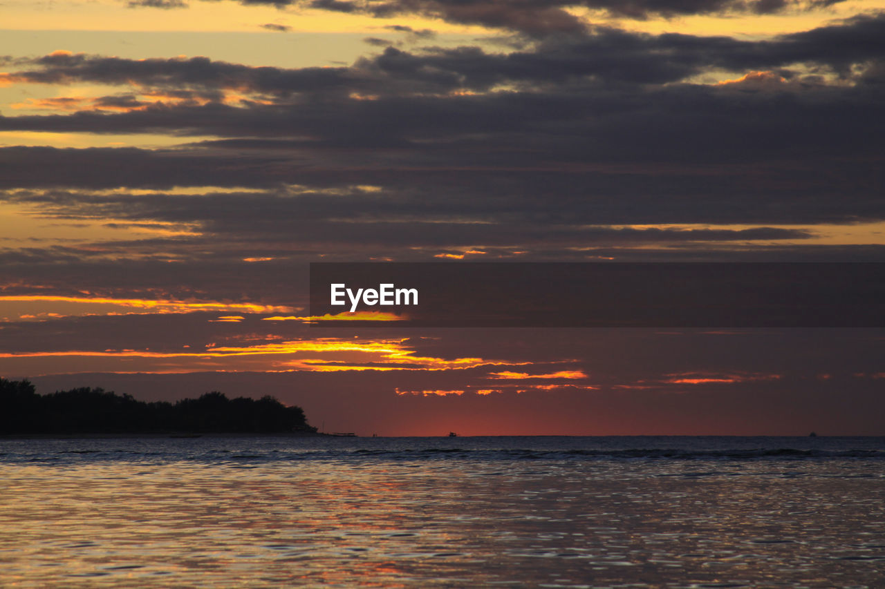 SCENIC VIEW OF SEA DURING SUNSET