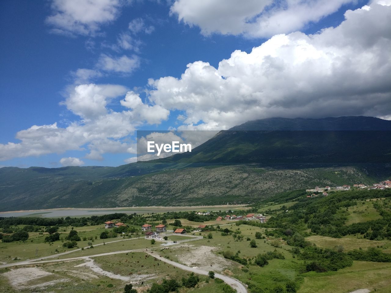 Scenic view of landscape and mountains against sky