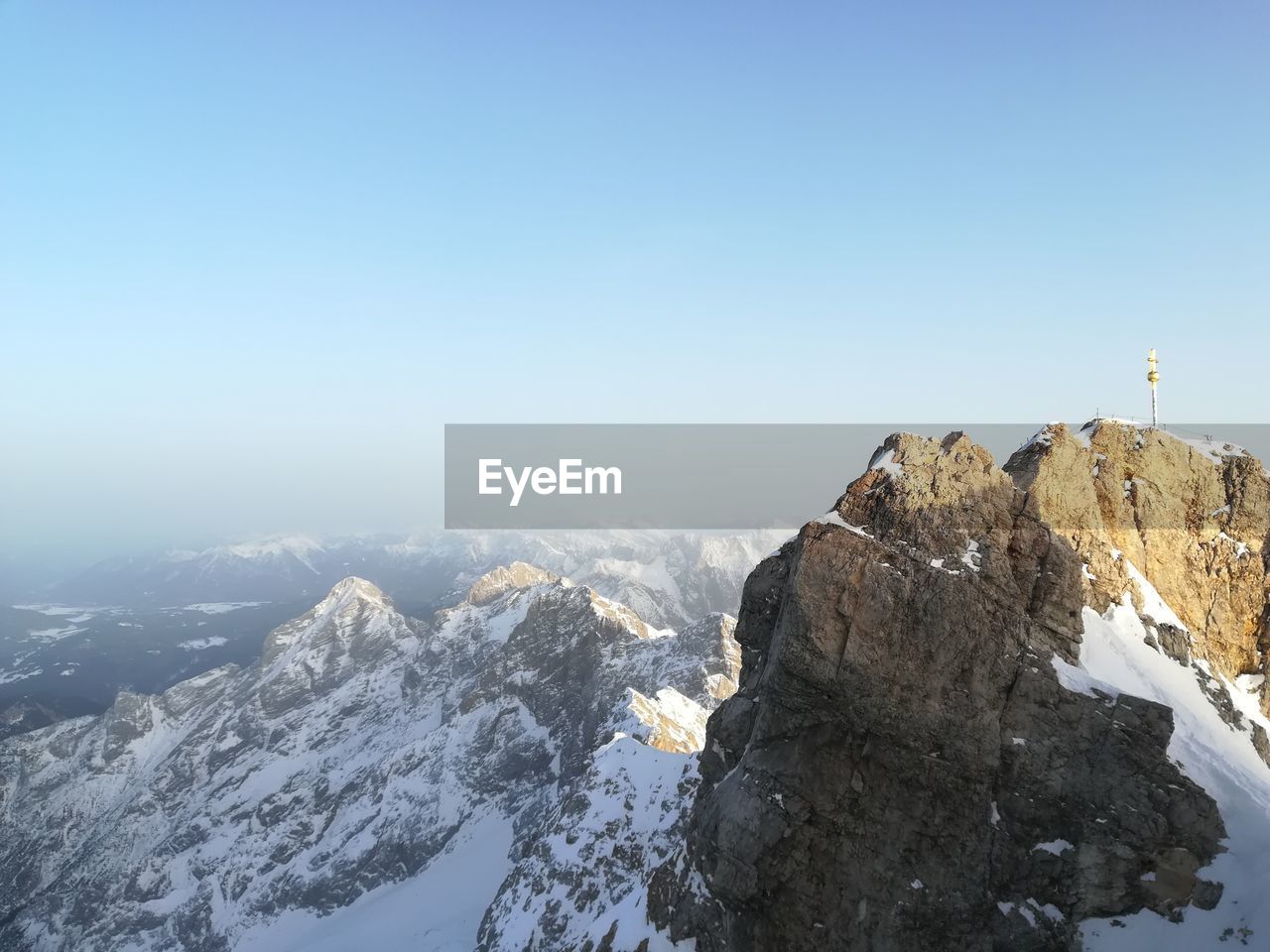 Scenic view of snowcapped mountains against clear sky