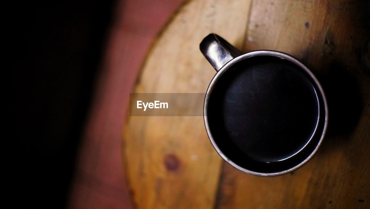 High angle view of black coffee on table