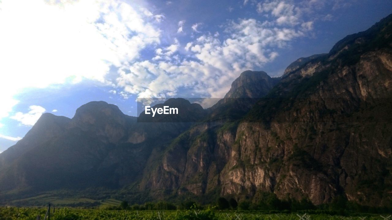 SCENIC VIEW OF MOUNTAINS AND SKY