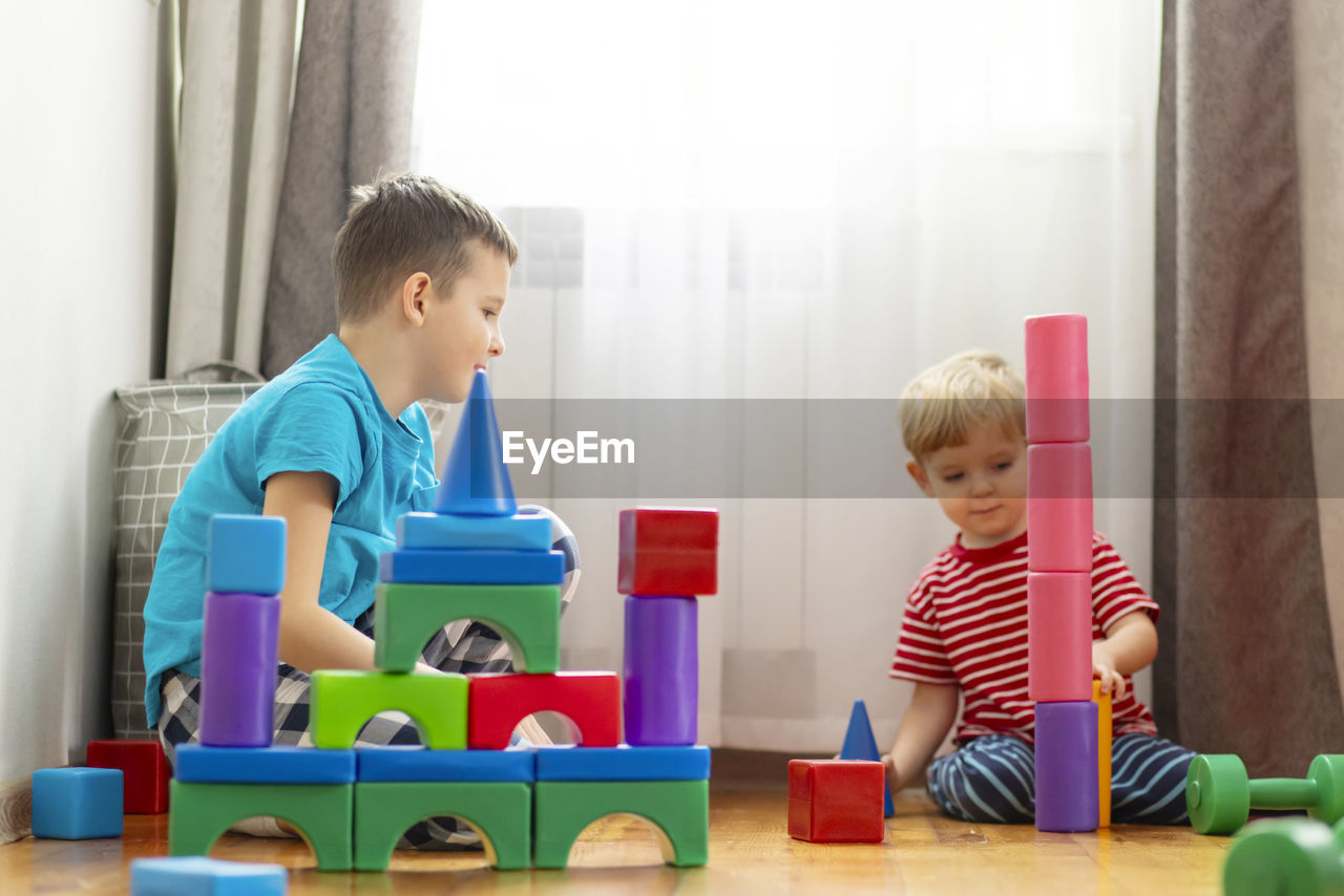 portrait of boy playing with toy blocks