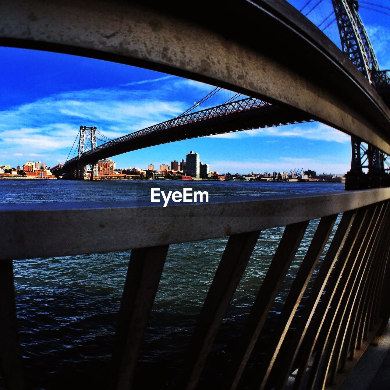 Williamsburg bridge over river seen from railing
