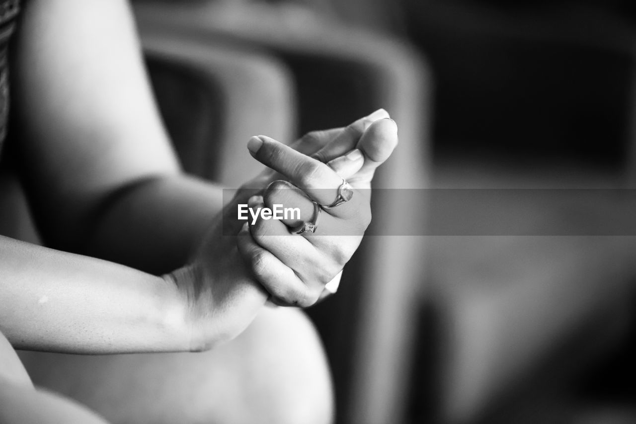 Cropped image of woman with hand clasped