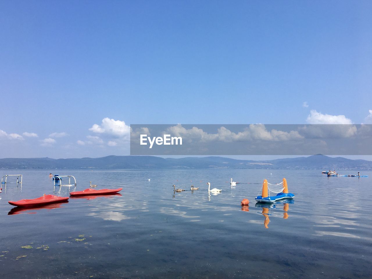 MEN ON SEA AGAINST SKY