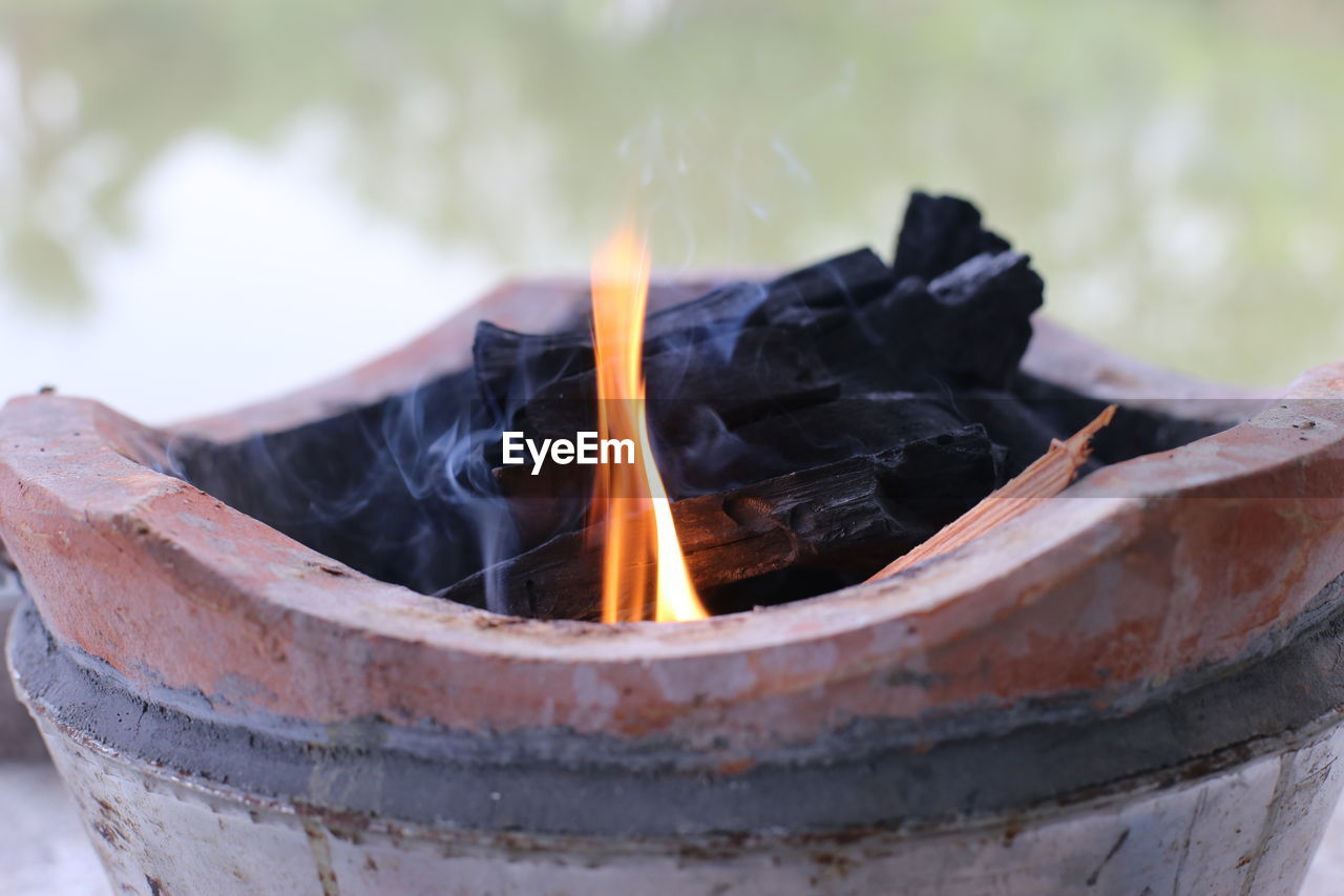 Making a fire in a brazier