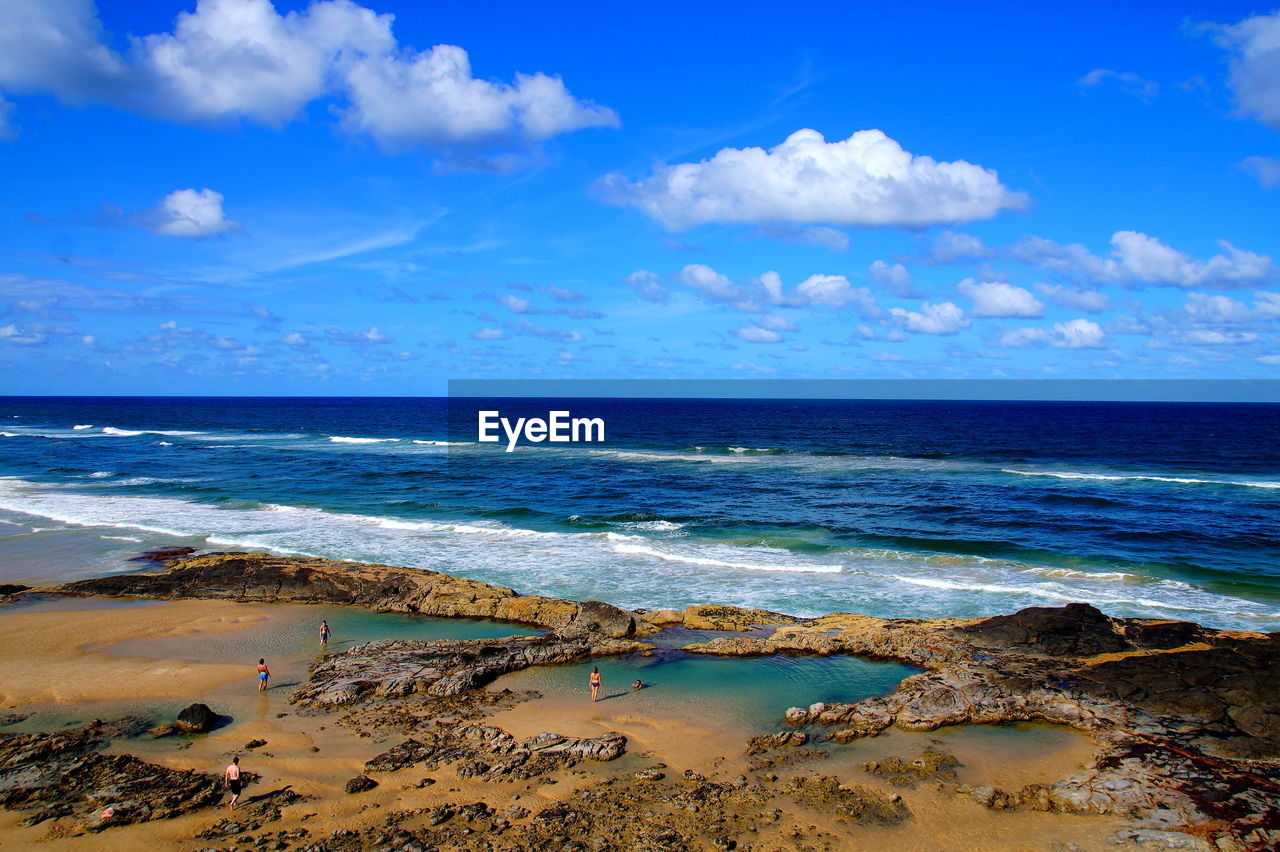 Scenic view of sea against blue sky