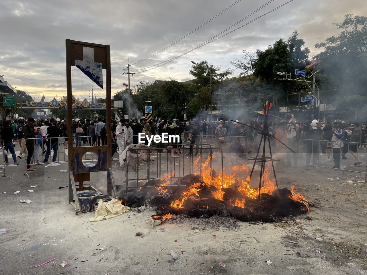 Thai anti government protests calling for democracy by burning symbolic stuff in thailand