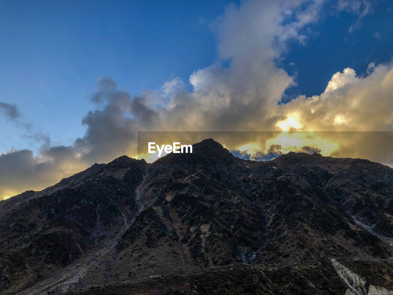 Scenic view of mountains against sky during sunset