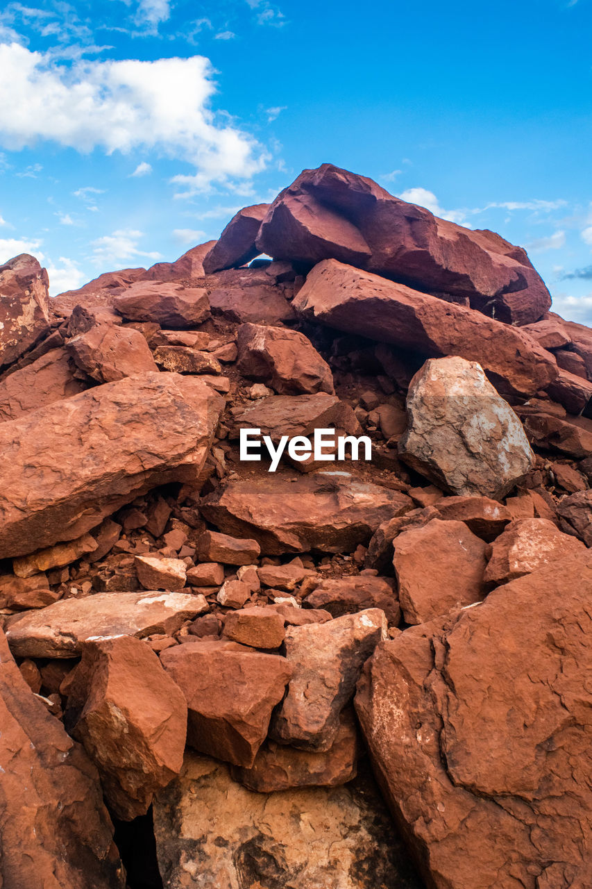 LOW ANGLE VIEW OF ROCK FORMATION AGAINST SKY