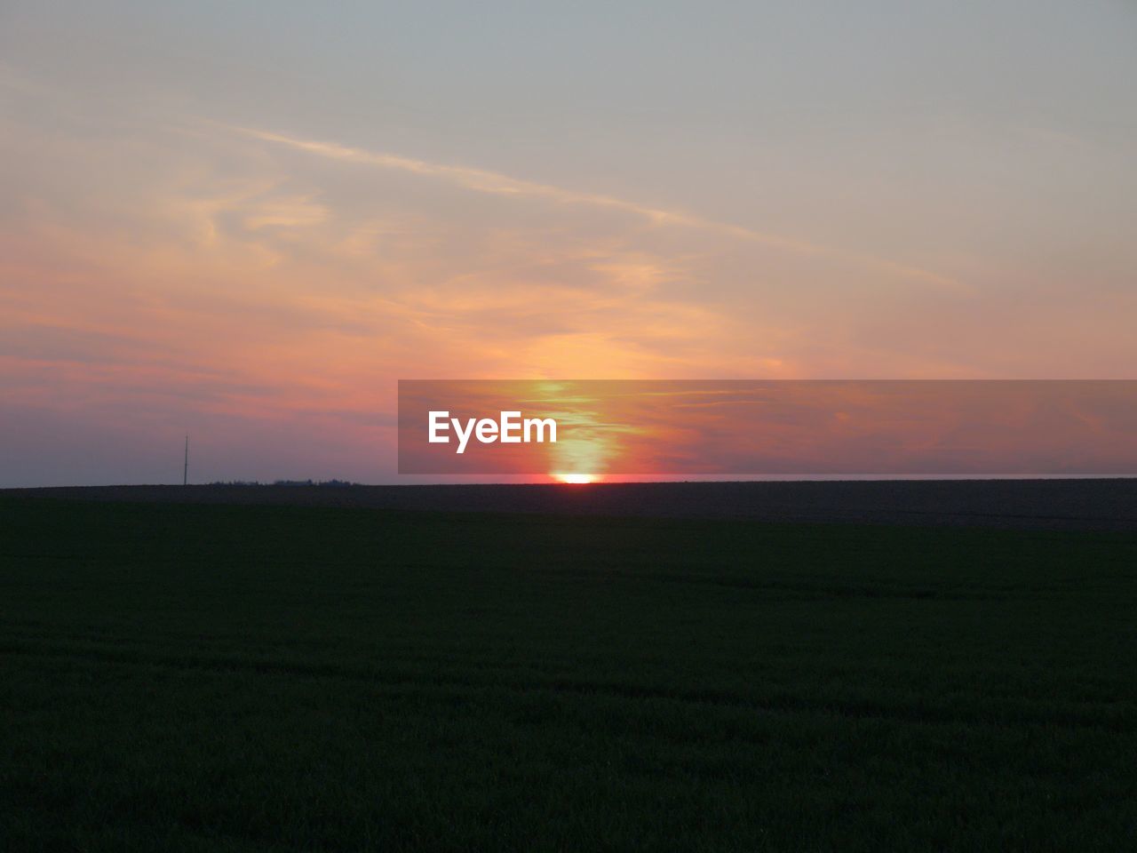 SCENIC VIEW OF SUNSET OVER LAND