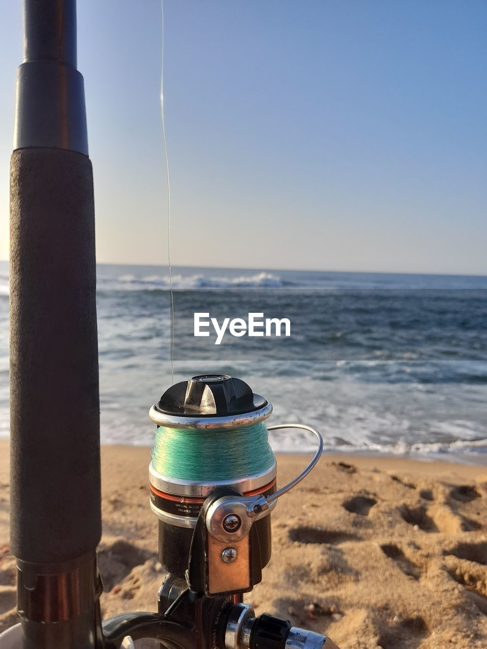 scenic view of beach against clear sky