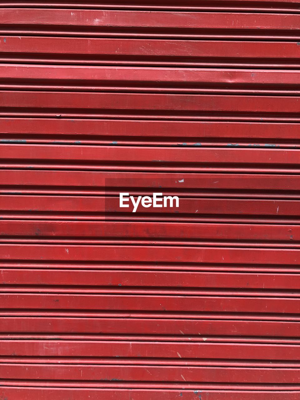 FULL FRAME SHOT OF RED SHUTTER