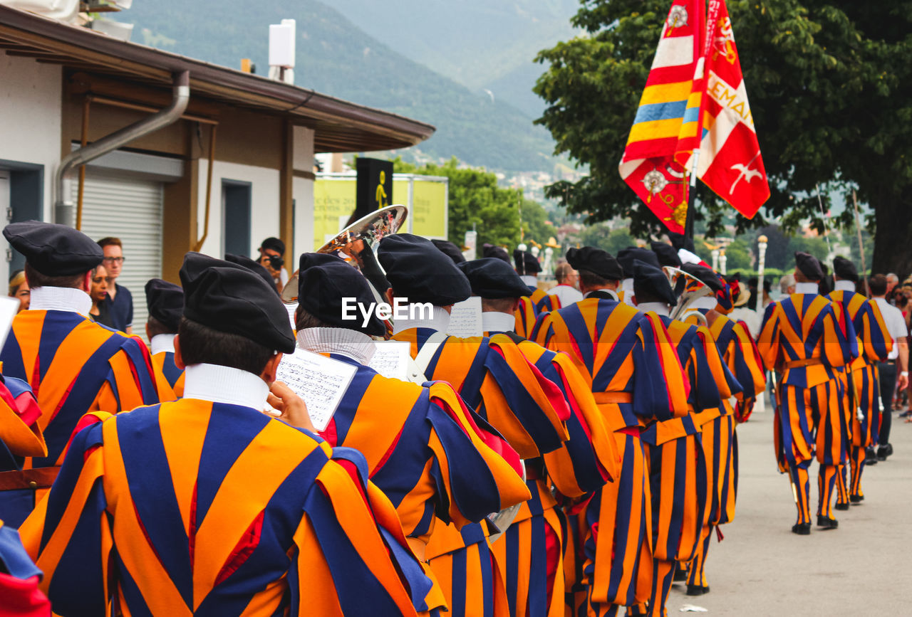 Rear view of marching band wearing uniforms