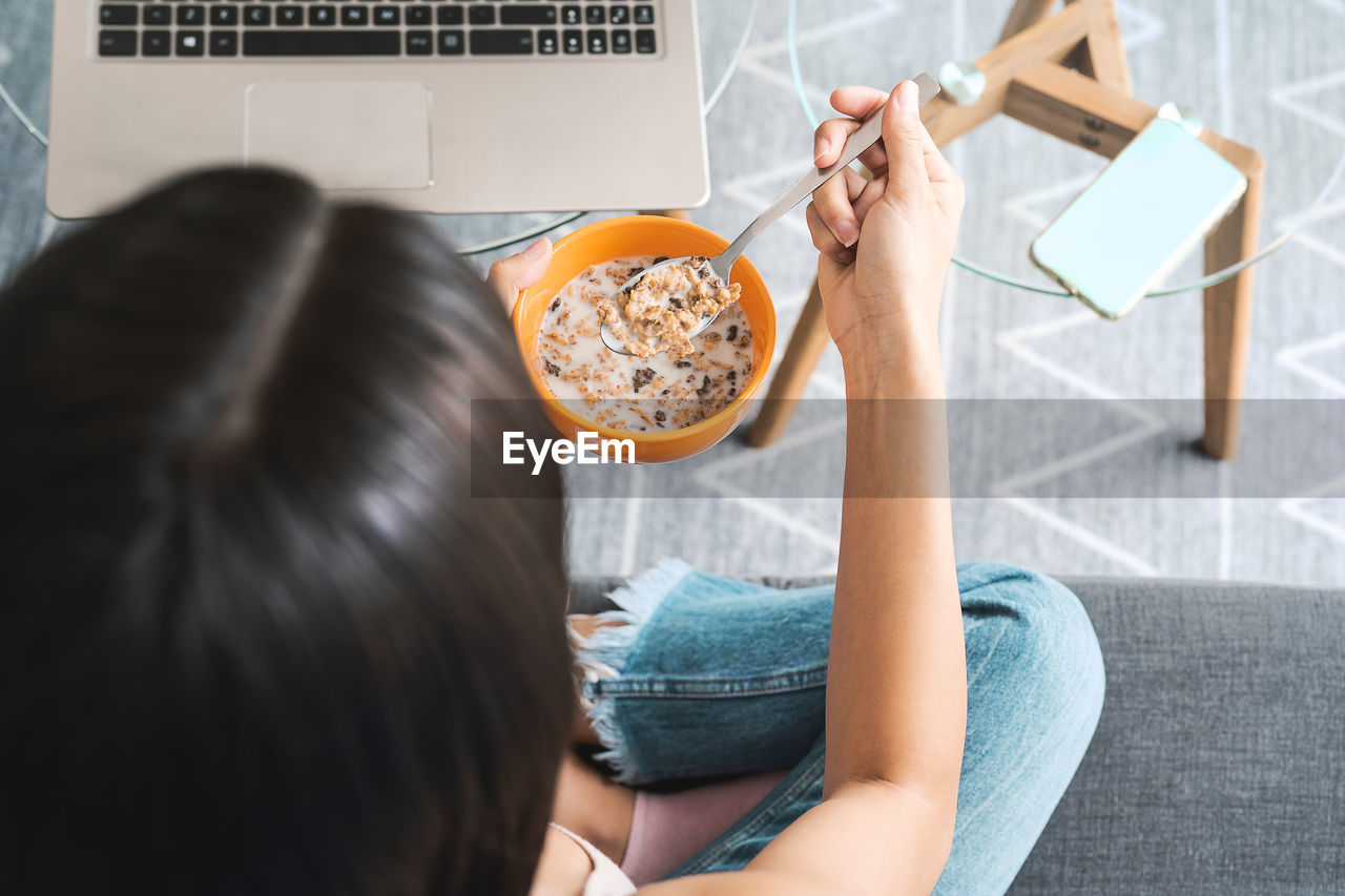 High angle view of woman having breakfast