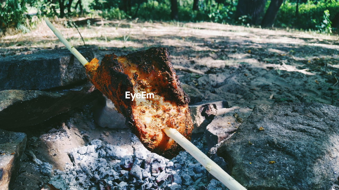 HIGH ANGLE VIEW OF FIRE ON WOOD