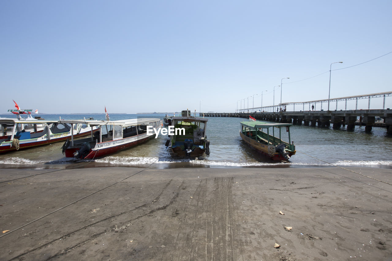 VIEW OF BRIDGE OVER SEA AGAINST SKY