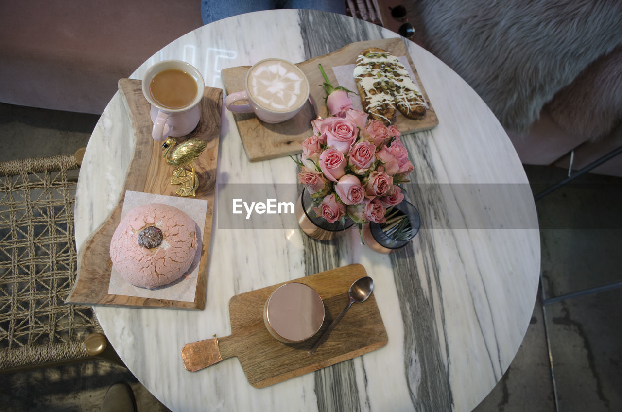 High angle view of bread and coffee and tea  on marble table